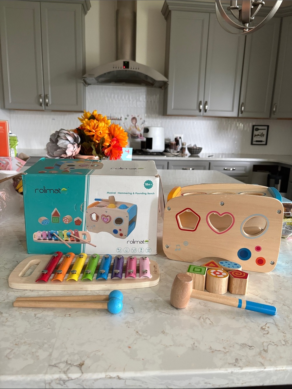 Montessori toy like Melissa & Doug Wooden Puzzle Bench Shape Sorter & instrument